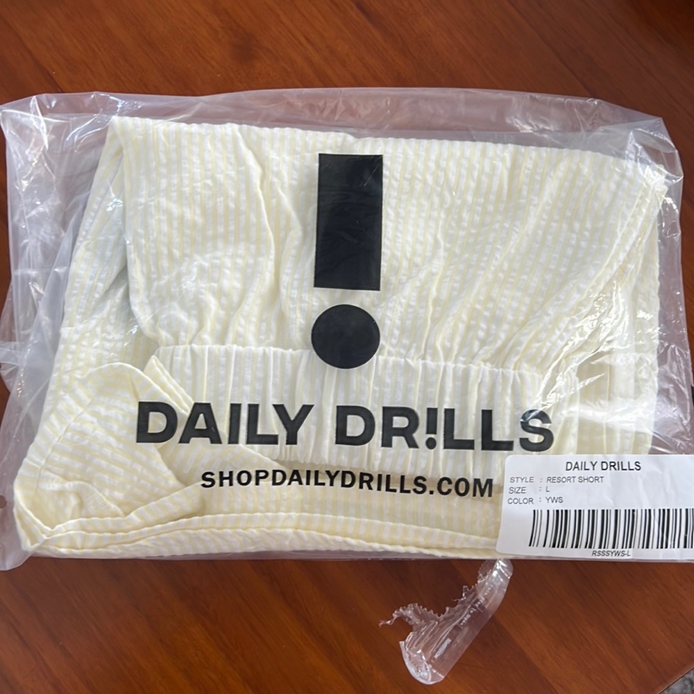 Daily Drills - seersucker resort shorts in light yellow/white stripe.